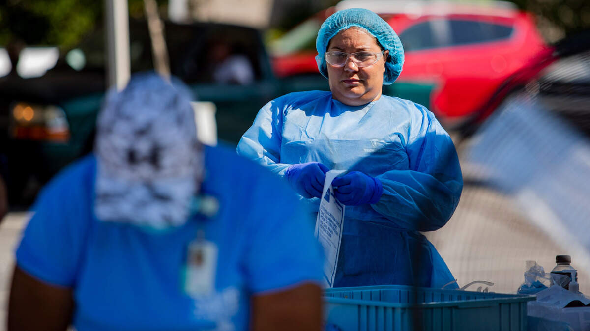 Tidelands Health medical professionals conduct a drive-through COVID-19 testing site Friday morning at Myrtle Beach Pelicans Ballpark. At least 63,880 people have tested positive for the coronavirus in South Carolina, and 1,053 have died, according to state health officials. Public health officials reported 1,842 new confirmed COVID-19 cases and 69 new confirmed deaths from the virus Thursday, the highest single-day death total DHEC has recorded since the pandemic began.