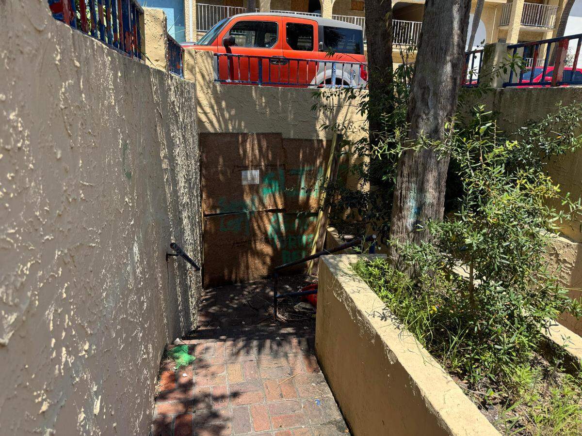 The Sea Mist tunnel’s entrances have been boarded off. Debris is present around the entryways.