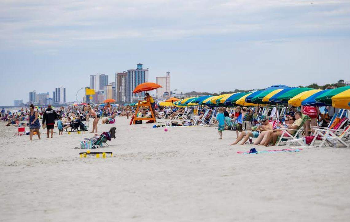 People gather along the beach Thursday afternoon in Myrtle Beach as coronavirus cases continue to spike. At least 20,551 people in South Carolina have tested positive for the coronavirus and 617 have died, according to state health officials. On Wednesday, the S.C. Department of Health and Environmental Control reported an additional 577 cases of the virus, continuing the state’s record-breaking streak of new coronavirus cases. DHEC officials have recorded at least 350 new cases each day since June 4.