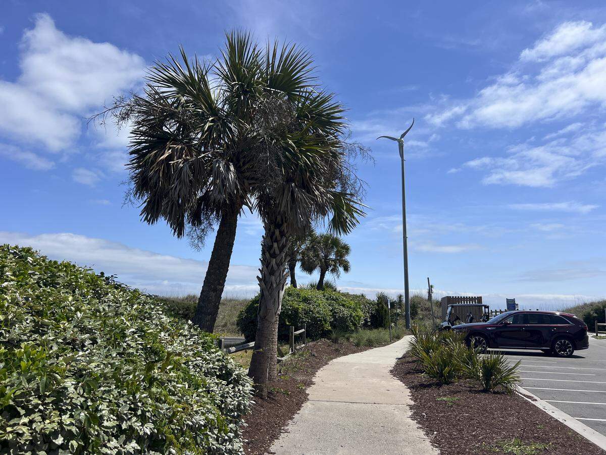 A wind turbine sits above the beach access at First Avenue South in North Myrtle Beach, SC. as part of South Carolina’s plan to test wind energy potential. Santee Cooper and the City of North Myrtle Beach constructed a few small turbines, mainly to increase public awareness. April 30, 2026.