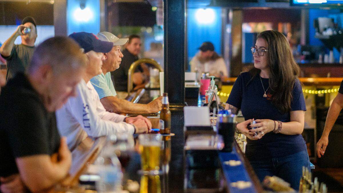 Ashley Schaef, works as a bartender at Sugrue’s Pub in North Myrtle Beach, S.C. Sept. 30, 2021.