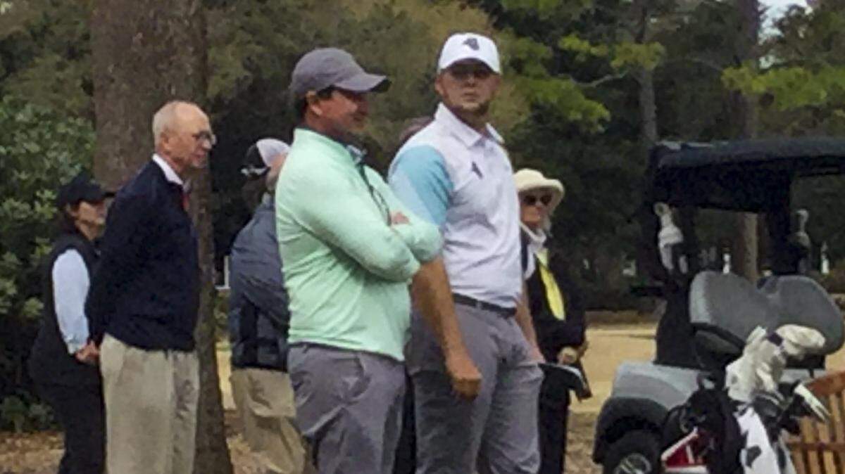 Coastal Carolina senior Zack Taylor and coach Jim Garren stand on the ninth tee at The Dunes Golf and Beach Club as Taylor waits to play his final tee shot in the 19th General Hackler Championship on March 10, 2020. Taylor won by two shots with an 8-under 208.