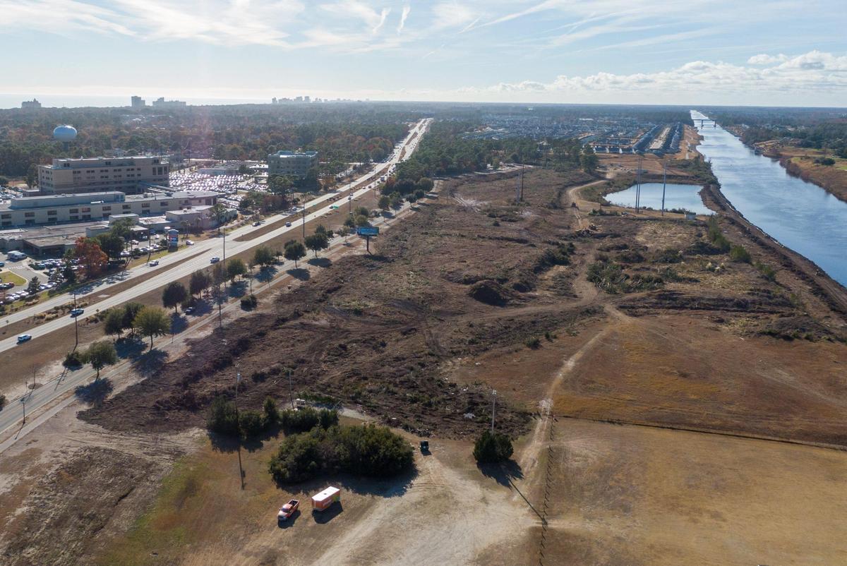 Land next to the Intracoastal Waterway has been cleared for the Marina Village by a Boston development group. The property is almost 76 acres and sits across the highway from the Grand Strand Hospital. Dec. 16, 2024.