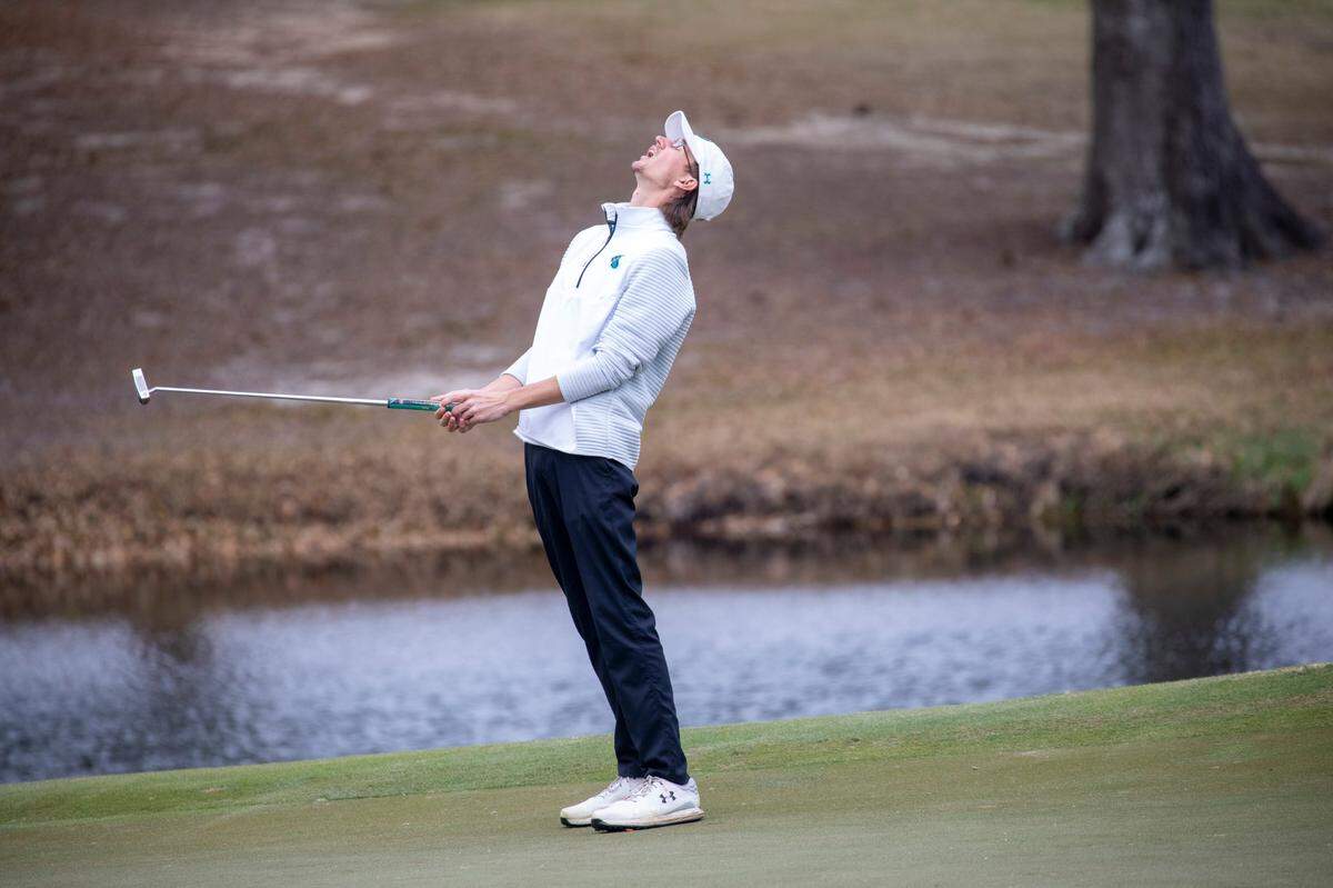 Coastal Carolina’s Seth Taylor reacts to a missed putt on the 18th gree at The Dunes Club on Monday in the VI Sports General Hackler Championship golf tournament in Myrtle Beach, S.C. March 15, 2021.