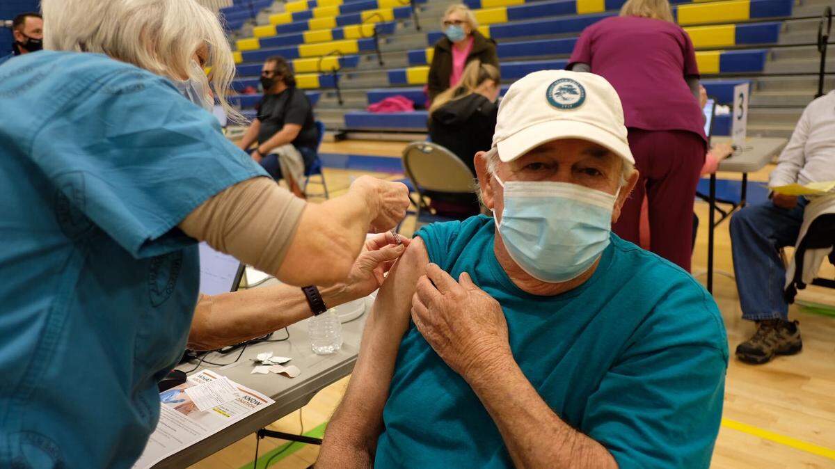 William “Chuck” Howie gets his COVID-19 vaccine at North Myrtle Beach High School.