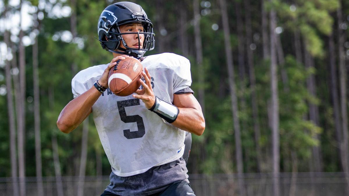 Carolina Forest senior quarterback Mason Garcia looks to pass during football practice at Carolina Forest High School Friday afternoon.