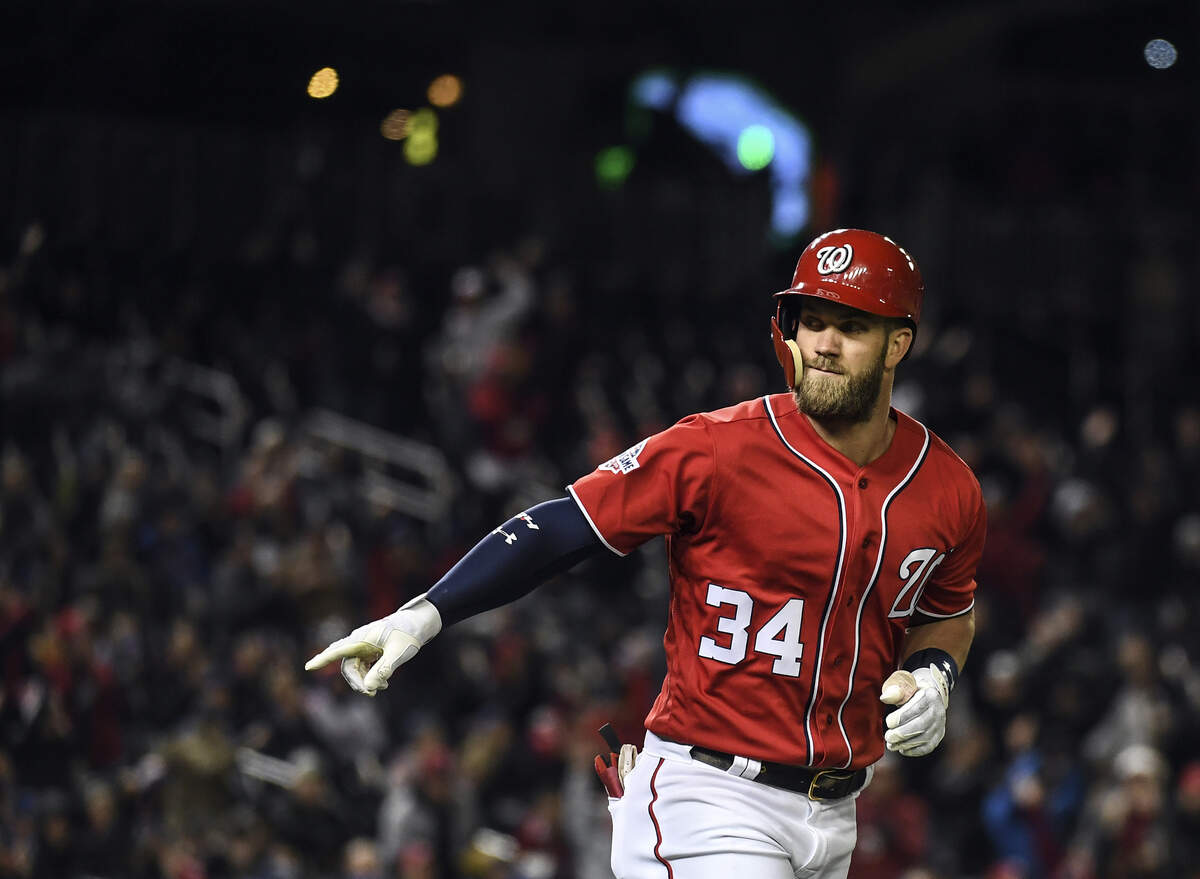 Washington Nationals right fielder Bryce Harper (34) point to the Washington Nationals’ dugout after hitting a two-run homer against the New York Mets at Nationals Park on April 8, 2018. MUST CREDIT: Washington Post photo by Toni L. Sandys.