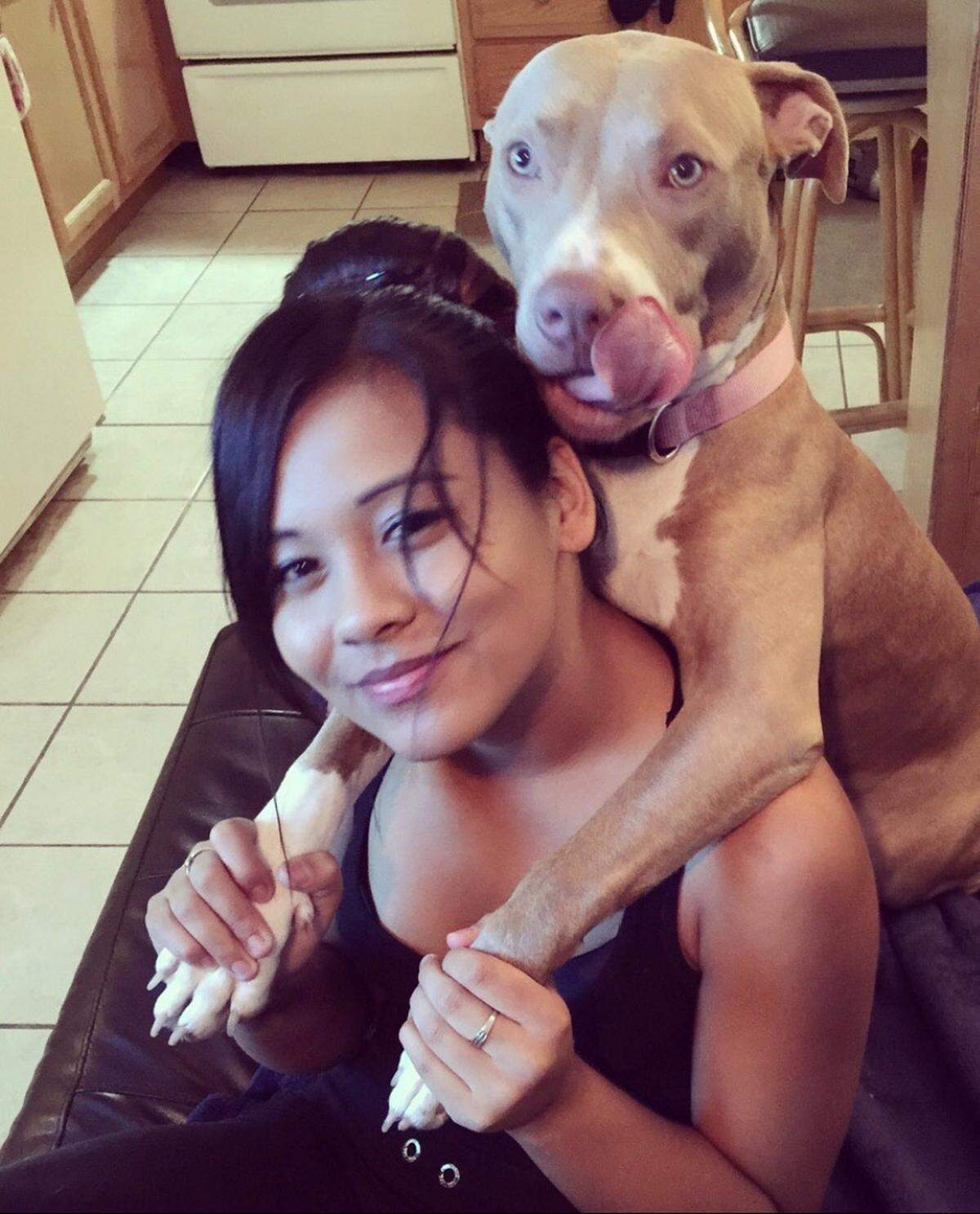 Angela Roberts with a pitbull. Her cousin, Bethany Colley, said she loved dogs. Roberts died from a gunshot to the head in the summer of 2021.
