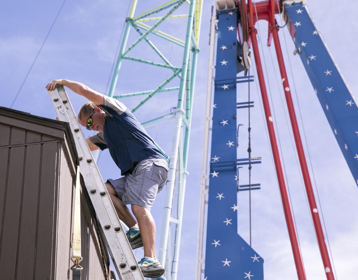 Glen Fowble works to secure the rides at Myrtle Beach’s Freefall Park. Myrtle Beach residents and businesses prepare for Hurricane Florence as it storms towards the coast on Monday. September 10, 2018.