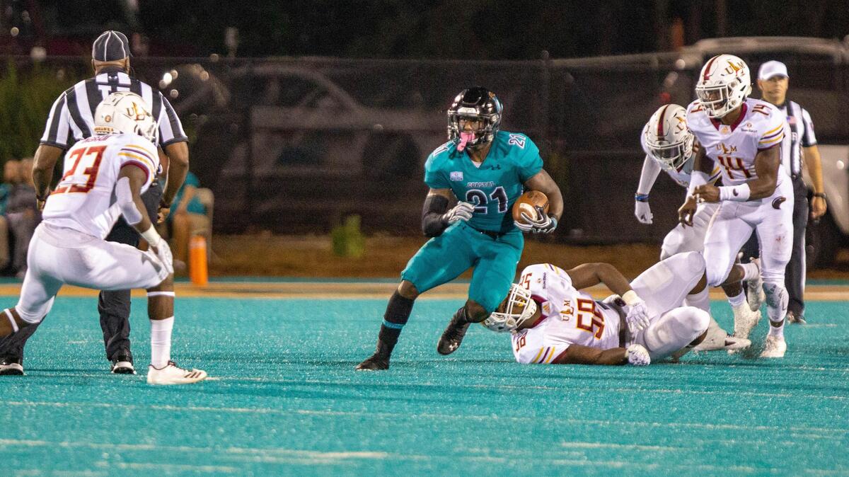 Coastal Carolina senior running back Marcus Outlow runs the ball against the University of Louisiana-Monroe on Oct. 13 at Brooks Stadium in Conway. Outlow ranks second in the Sun Belt Conference in rushing yards with 624 and rushing yards per game with 89.1 this season.