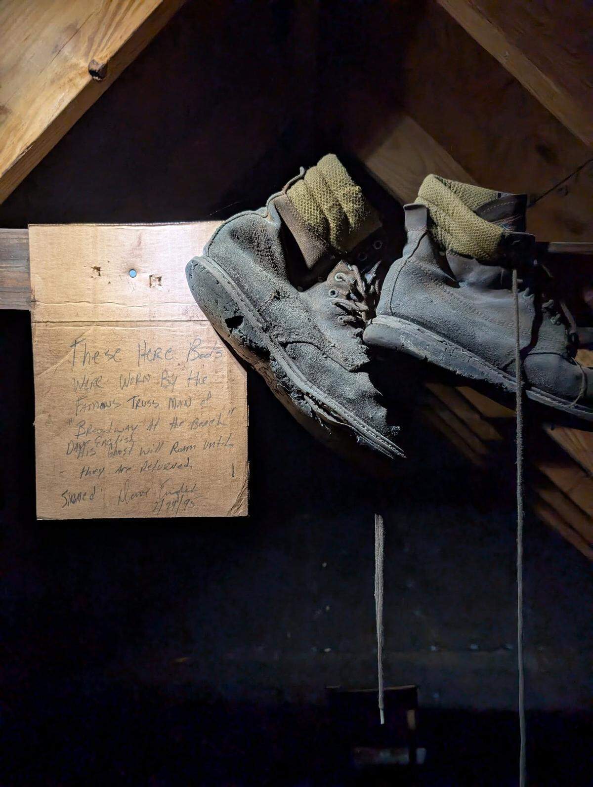 Jason Cooper captures the note and boots supposedly left by Dave English more than 30 years ago.