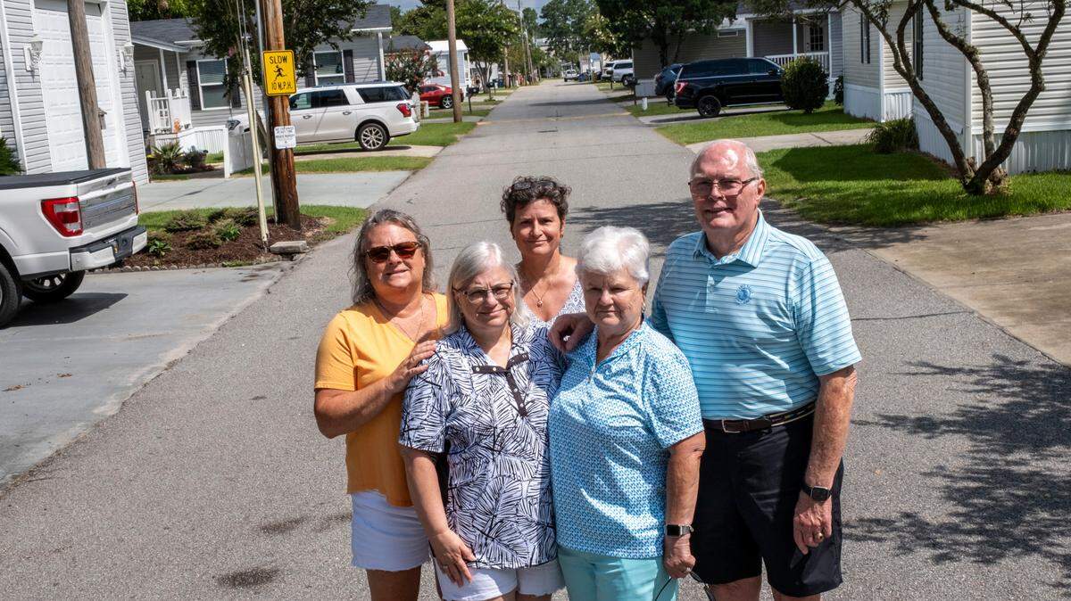 Members of the Patrick Family stand in the middle of Mobile Street in Patrick’s Mobile Home Park where ‘Welcome to Myrtle Manor’, a reality TV show set in Myrtle Beach, was filmed in Myrtle Beach, S.C. July 6, 2023.