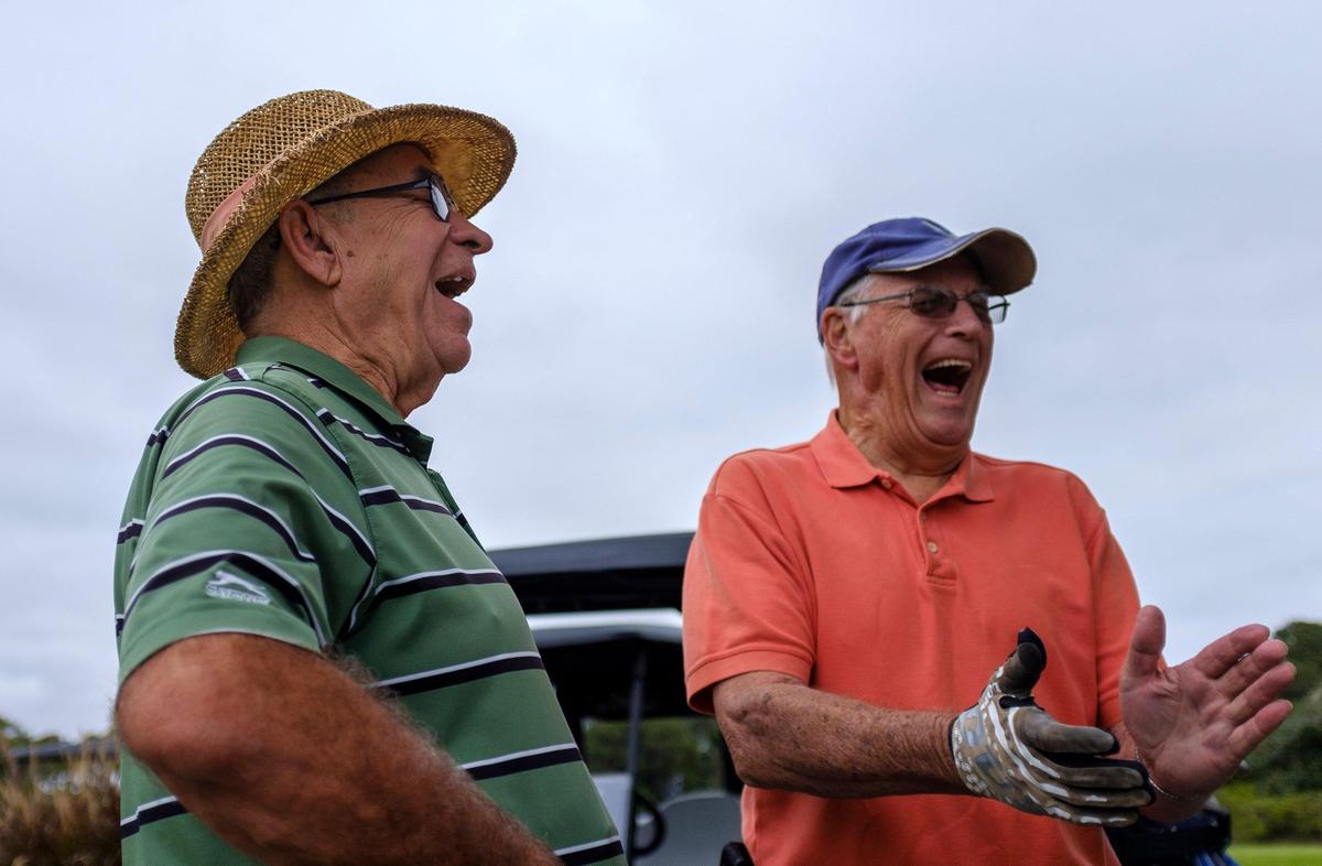 Ron Bingeman (left) and Everett Cassel (right) laugh at a joke during a golf outing at The Dunes Golf and Beach Club. Members of the Philadelphia golf foursome have been coming to Myrtle Beach on golf holiday for 50 consecutive years. Oct. 10, 2019.