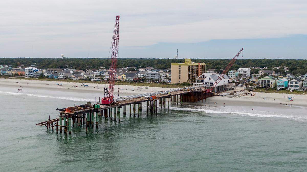 Construction of a new $20 million dollar Surfside Beach Pier is ongoing after multiple delays and is now expected to re-open by the Spring of 2023. The former pier was sheared in half by Hurricane Matthew in 2016. The new construction includes space for four merchants in three buildings with a pavilion near the end of the pier. September 27, 2022.