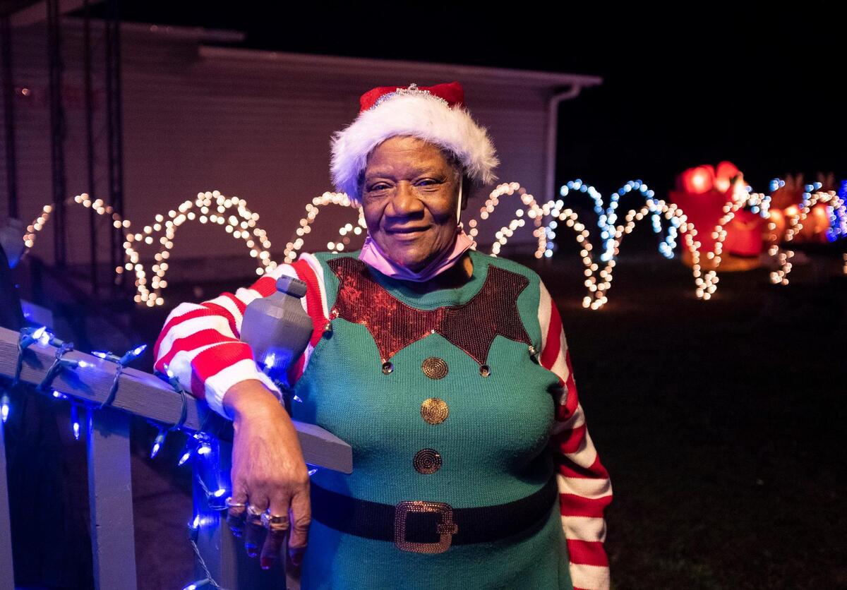 Hattie Williams stands amount her Christmas decorations on Williamson Road in Longs. The Freemont subdivision in Longs has been lit in Christmas lights with residents hoping to spread holiday cheer to a neighborhood that has been trouble by violence and the spread of COVID-19 this year. December 17, 2020.