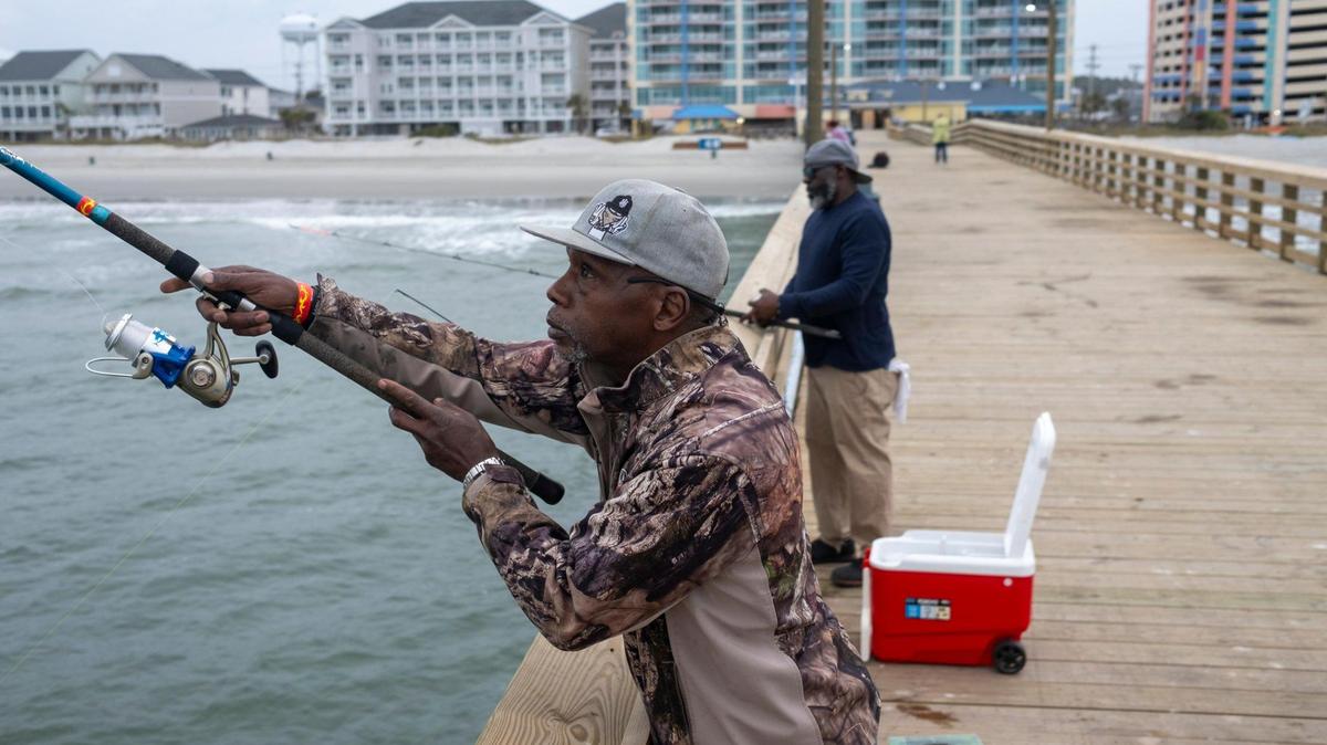 Rossi Rose of Calabash, NC and Bennett Covington of Kanapolis, NC were the first fisherman to arrive at the Cherry Grove pier after it reopened today. The Cherry Grove Pier at Prince Resort partially reopened today in North Myrtle Beach after being closed for repairs since Hurricane Ian damaged the structure in 2022. About two-thirds of the walkway is open to fishermen and walkers as final repairs are made to the end of the pier. March 22, 2024.