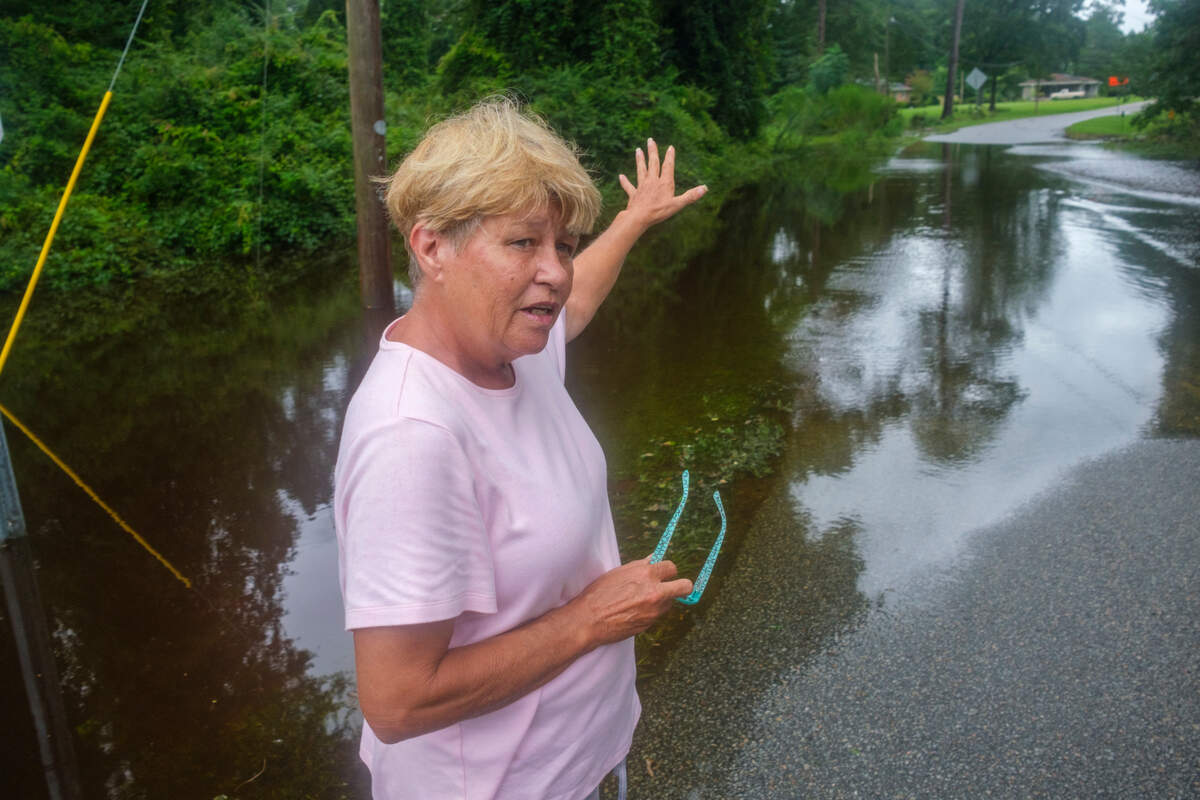 Sonia Jones describes the issues her neighborhood has had with flooding in recent storms. Jones is working to document the issues in her community. Streets and homes around Loris, SC flooded due to the heavy rainfall associated with Tropical Storm Debby. Aug. 8, 2024.