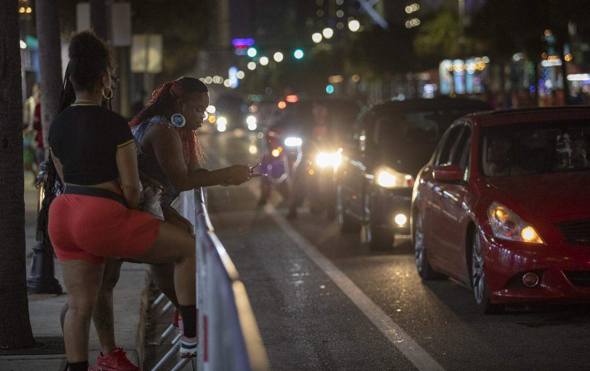 Bikefest attendees watch as traffic rolls by slowly Saturday evening on Ocean Boulevard in Myrtle Beach.