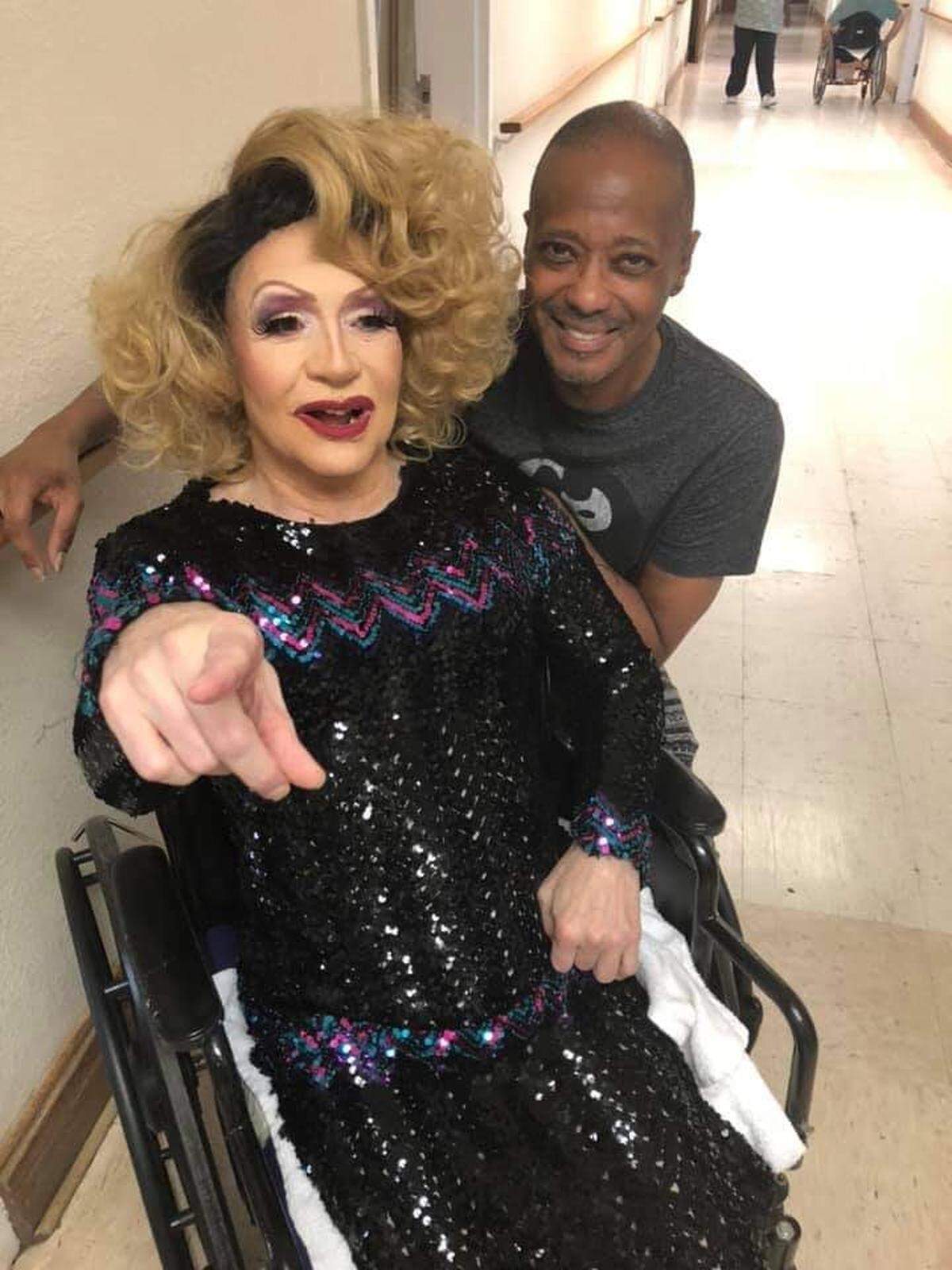 Ron Daugherty, left, got dressed up as the drag queen Miss Erica Sommers one last time on Halloween in 2019 with help from fellow drag queen Morgan Richards. Daugherty died Jan. 16, 2021.
