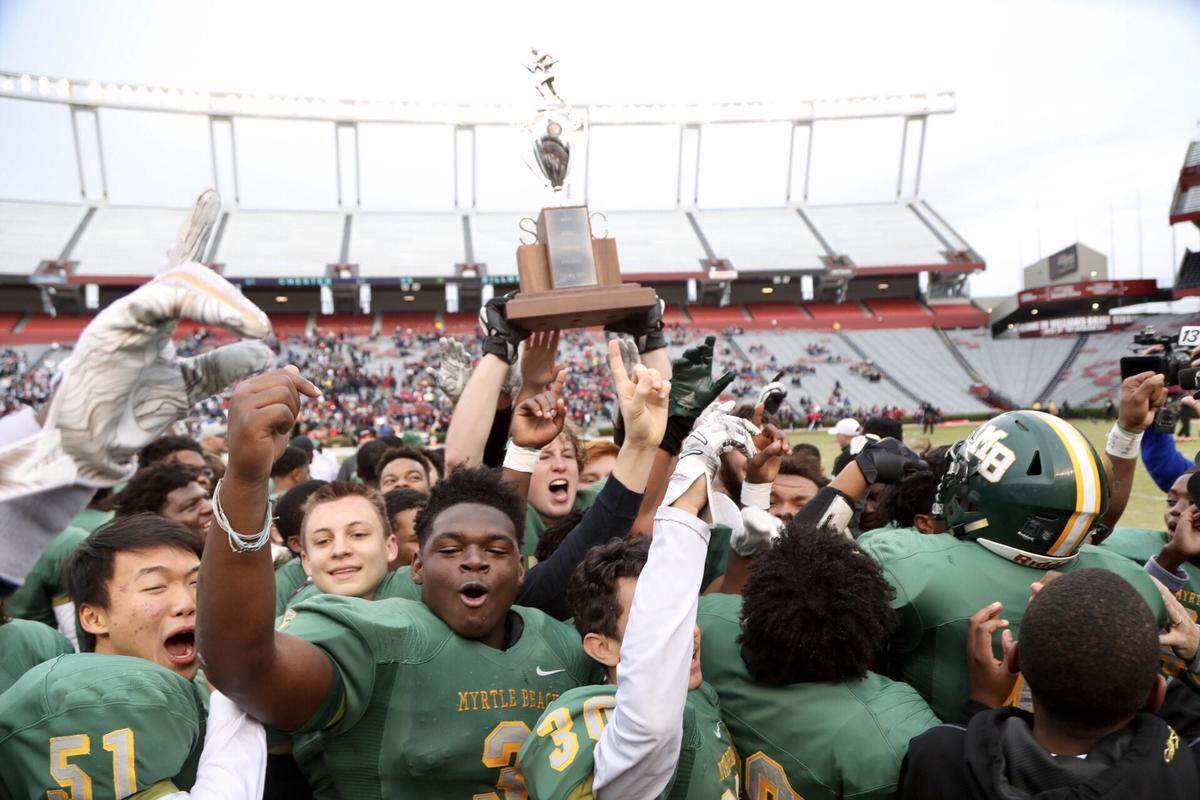Myrtle Beach High School celebrates after it defeated Greer in the 4A state championship Friday afternoon in Columbia.