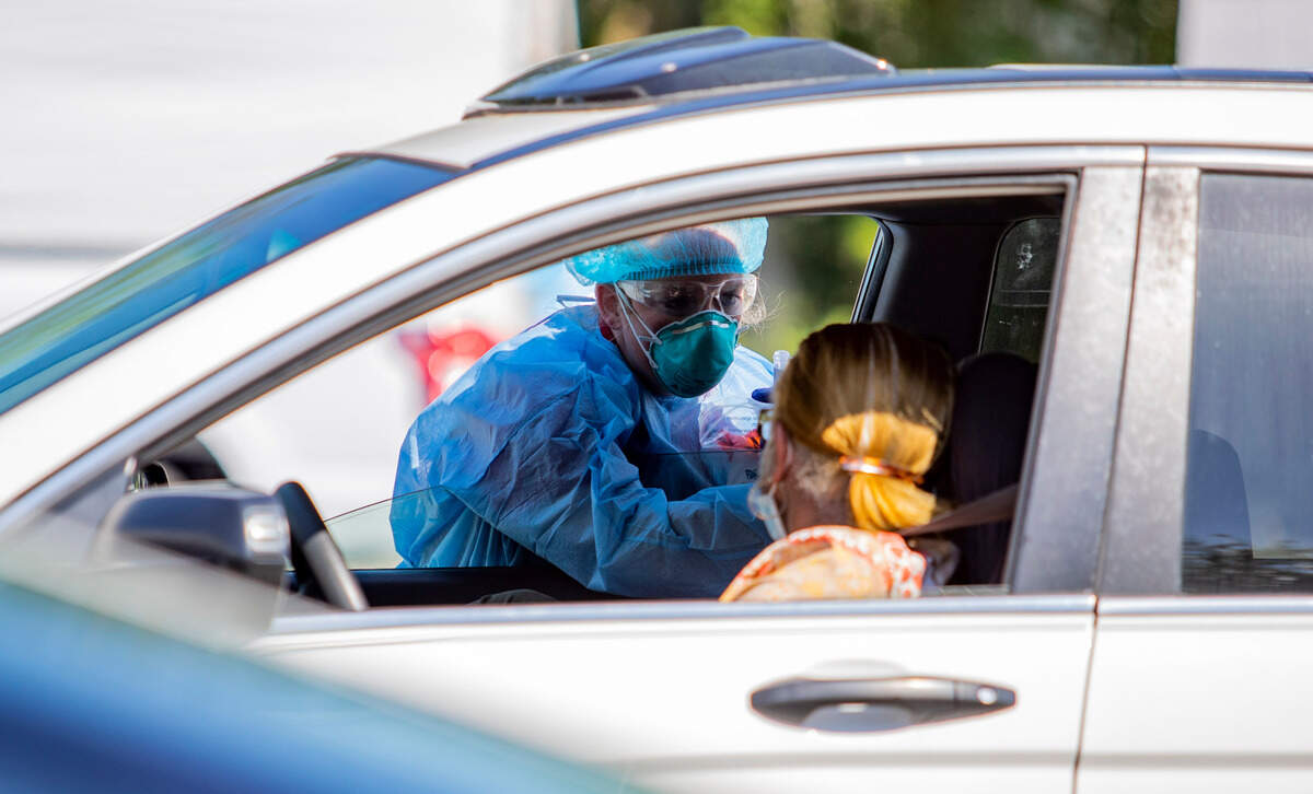 Tidelands Health medical professionals conduct a drive-through COVID-19 testing site in July at Myrtle Beach Pelicans Ballpark.