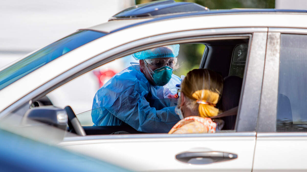 Tidelands Health medical professionals conduct a drive-through COVID-19 testing site in July at Myrtle Beach Pelicans Ballpark.