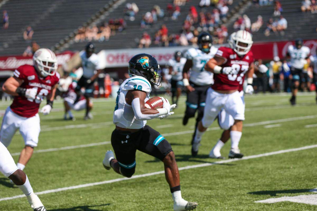 Coastal Carolina receiver Aaron Bedgood breaks free for yardage against UMass as a freshman on Sept. 21, 2019 during CCU’s 62-28 win in Amherst, Mass.