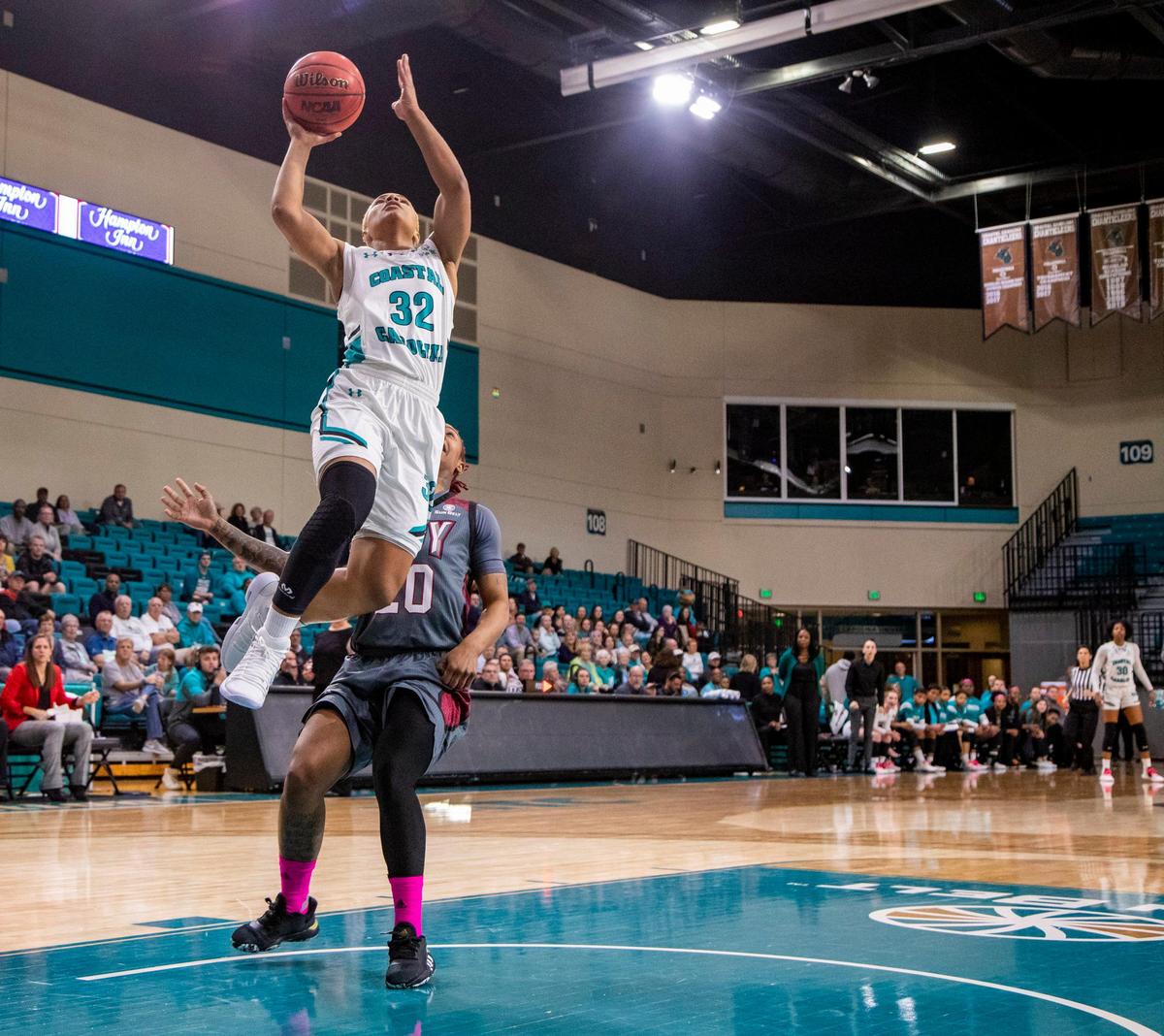 Coastal Carolina senior guard D.J. Williams scores two of her 51 points Thursday night against Troy at the HTC Center in Conway.