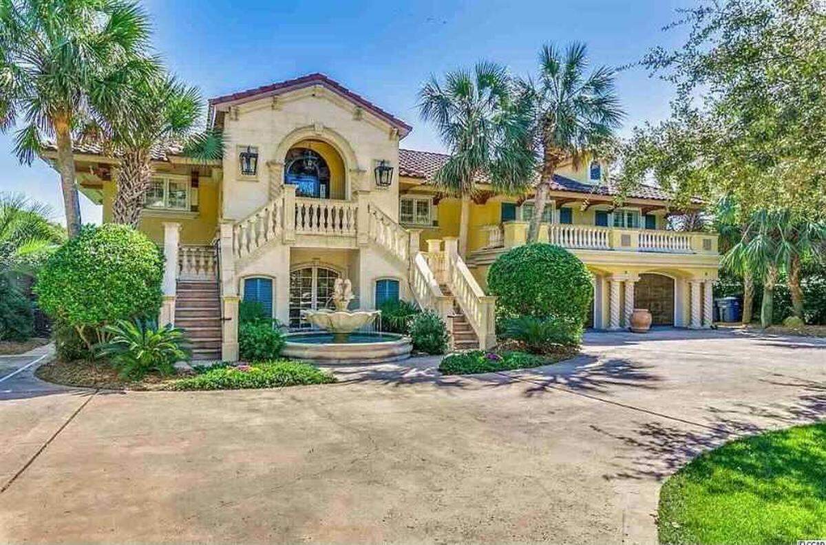 A gated beach house is for sale in Myrtle Beach on Ocean Boulevard for nearly $3 million. It has an oceanfront terrace, fitness room and two car garage.