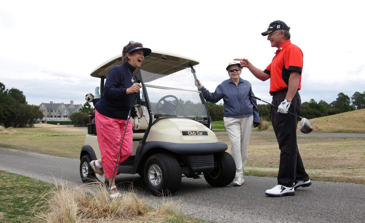 Single Golfers Association members talk before a round of golf at the Legends Golf Club on Sunday, March 21, 2010. File photo.