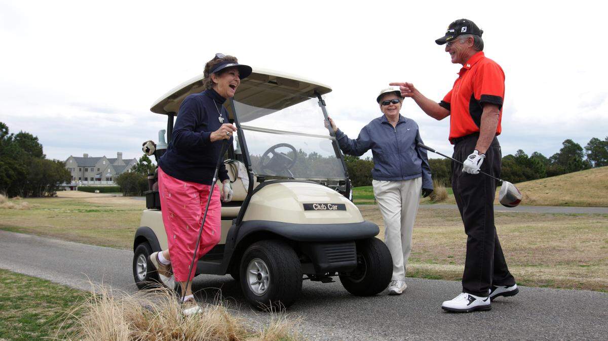 Bob Sperl (right), of Myrtle Beach, Susan Hammond (left), of Leland, NC, and Carol Humphreys, of Sunset Beach, talk before a game of golf at a Single Golfers Association meeting at the Legends Golf Club on Sunday, March 21, 2010. File photo.
 