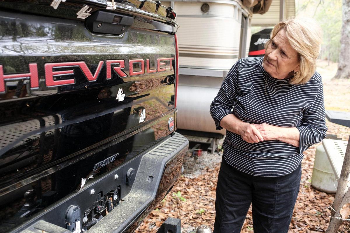Deborah Spivey, mother of Scott Spivey, looks at the bullet holes in her son’s truck. Scott Spivey was killed in a road rage incident on Sept. 9, 2023 at Camp Swamp Road in Longs, SC. Neither of his shooters, Weldon Boyd and Kenneth “Bradley” Williams, were charged in the incident. March 31, 2025.