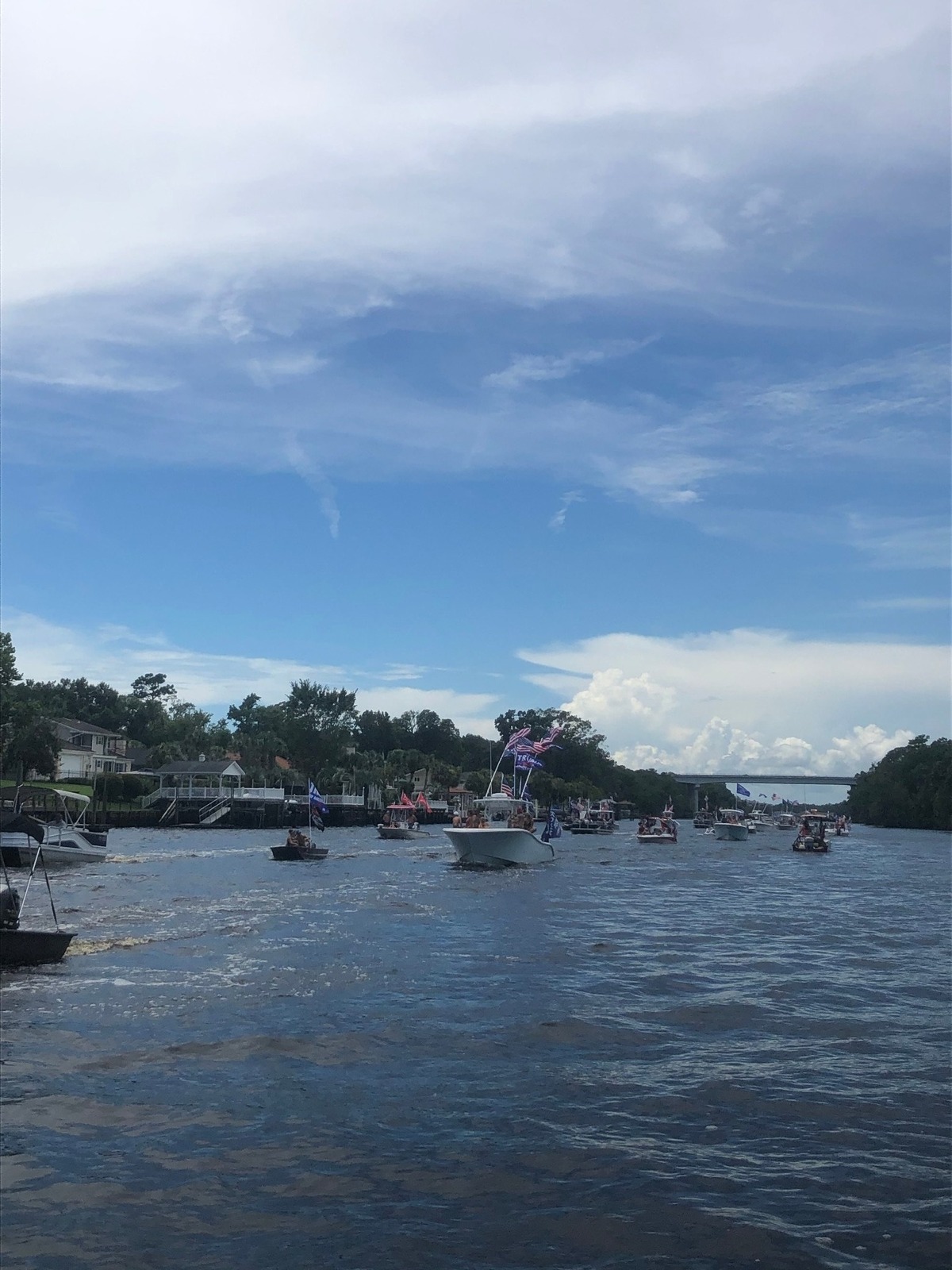 Donald Trump flags fly from boats on the Intracoastal Waterway during a boat parade in support of the president. It began near the Boathouse in Myrtle Beach and concluded at Barefoot Landing in North Myrtle Beach. | July 26, 2020