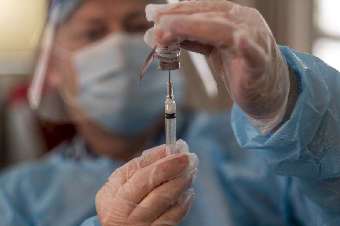 CVS pharmacist Ernest Broome prepares the Moderna vaccine for injection into senior care patients at The Lakes at Litchfield. The Lakes was one of the first senior care facilities in South Carolina to receive the Moderna COVID-19 vaccine on Monday. December 28, 2020.