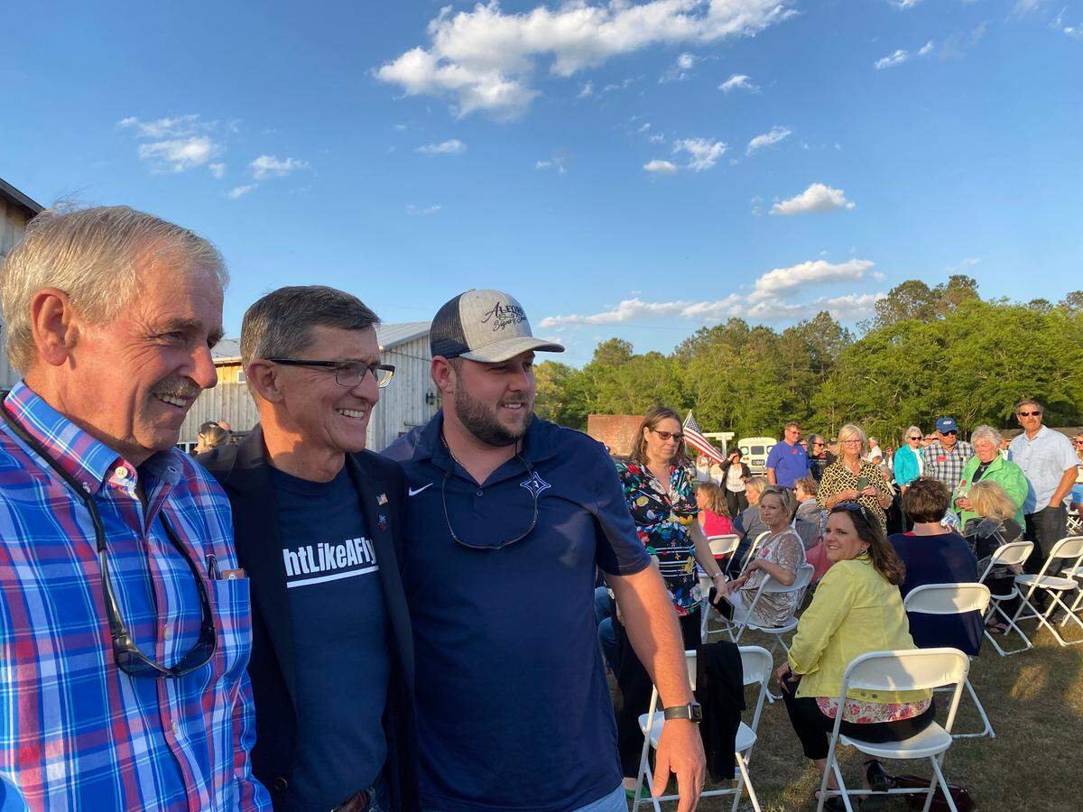 Former National Security Advisor Gen. Michael Flynn poses for photos with supporters at an event meant to garner support for new Horry County Republican Party leaders.