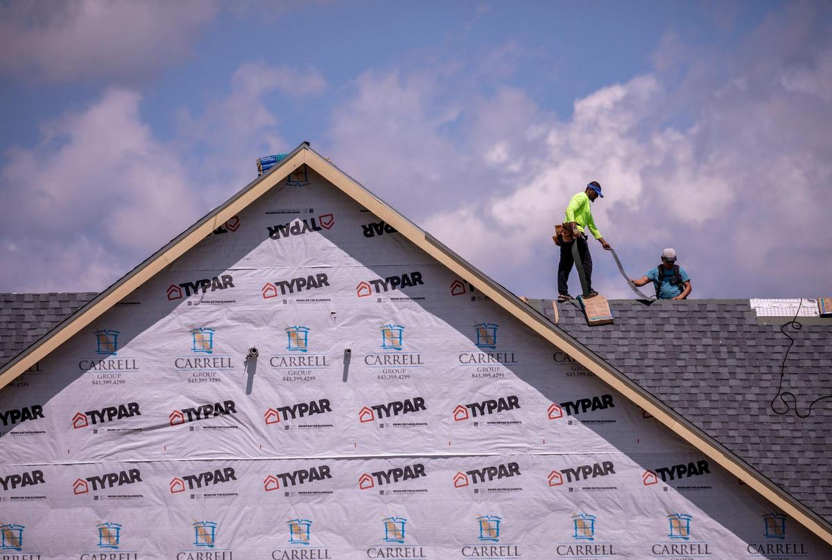 A roofing contractor works on a new home in Waterside Pointe, a Grande Dunes neighborhood in Myrtle Beach. New development continues along the Intracoastal Waterway in the Myrtle Beach area. May 5, 2020