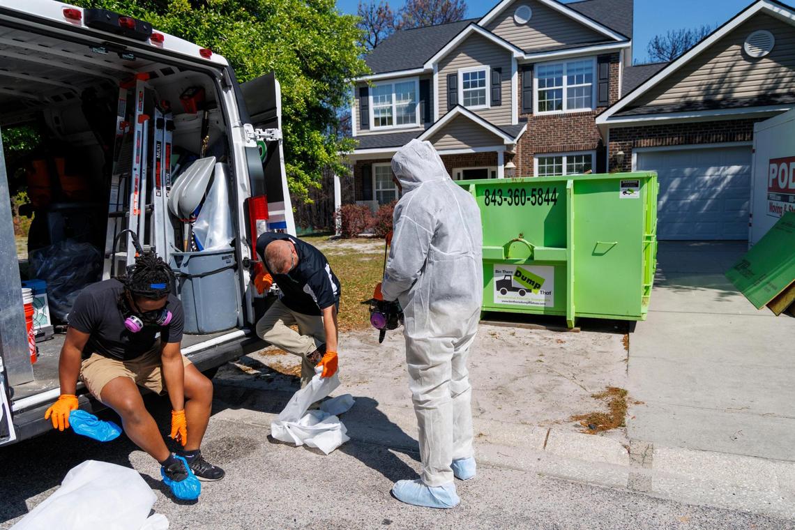 Workers are still cleaning up homes damaged by smoke and soot in The Preserve at Walker’s Woods by the Carolina Forest wildfire last month. Firefighters and forestry officials continue to monitor flare-ups in the Carolina Forest wildfire that was started in the beginning of March 2025. The fire burned more than 2,000 acres and is 90 percent contained but officials say it continues to smolder underground. April 17, 2025.