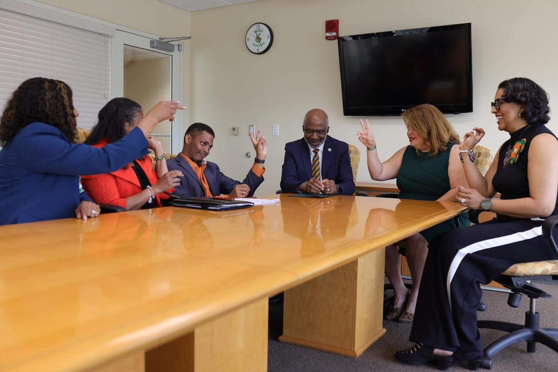 Gregory Gerami (third from left) celebrates with Florida A&M University officials after signing an agreement to donate $237 million to the school. The gift was later deemed fraudulent.