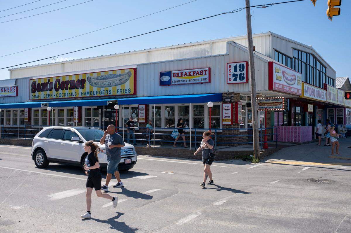 Sam’s Corner, a local hotdog stand reopened this weekend after being damaged by Hurricane Ian in the Fall of 2022. Grand strand residents and visitors head for the beach on the first sunny weekend of Spring. March 24, 2023.