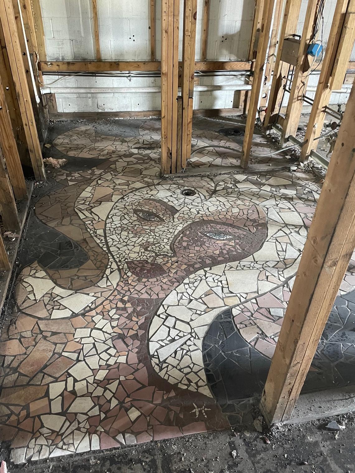 This tile mosaic was on the floor of of Collector’s Cafe, a restaurant and art gallery that burned down in 2020. Owner Tommy Davis plans to rebuild Collector’s and preserve works of art inside it like this one.