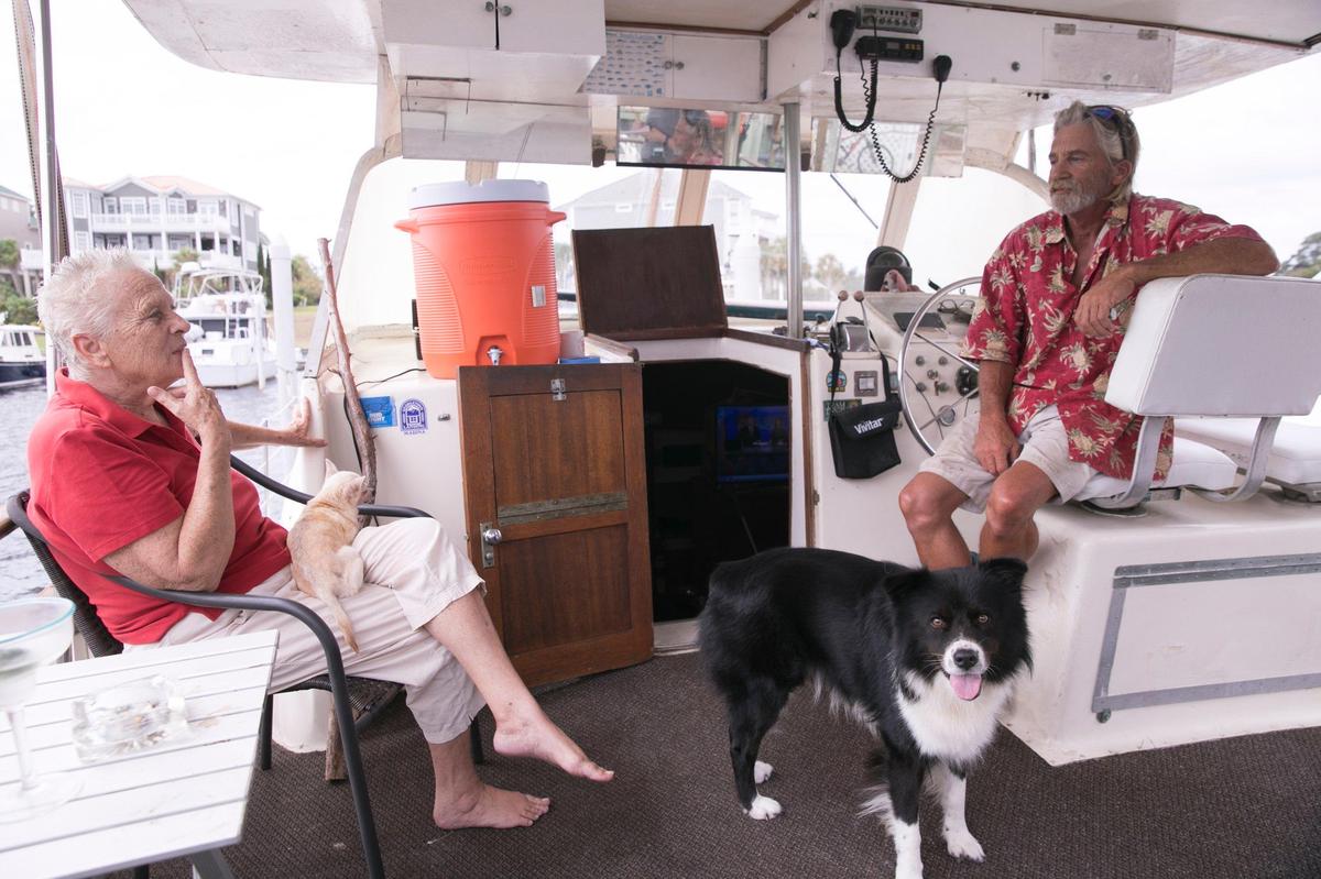 Tim Atkinson is riding out Hurricane Florence in his thirty six foot Hattaras boat in Doc Holiday’s Marina with his wife Judy and two dogs Douglas and Roxie. “I feel safer here than anywhere his wife Judy said, and our dogs are at home here.” Wednesday, September 10, 2018.