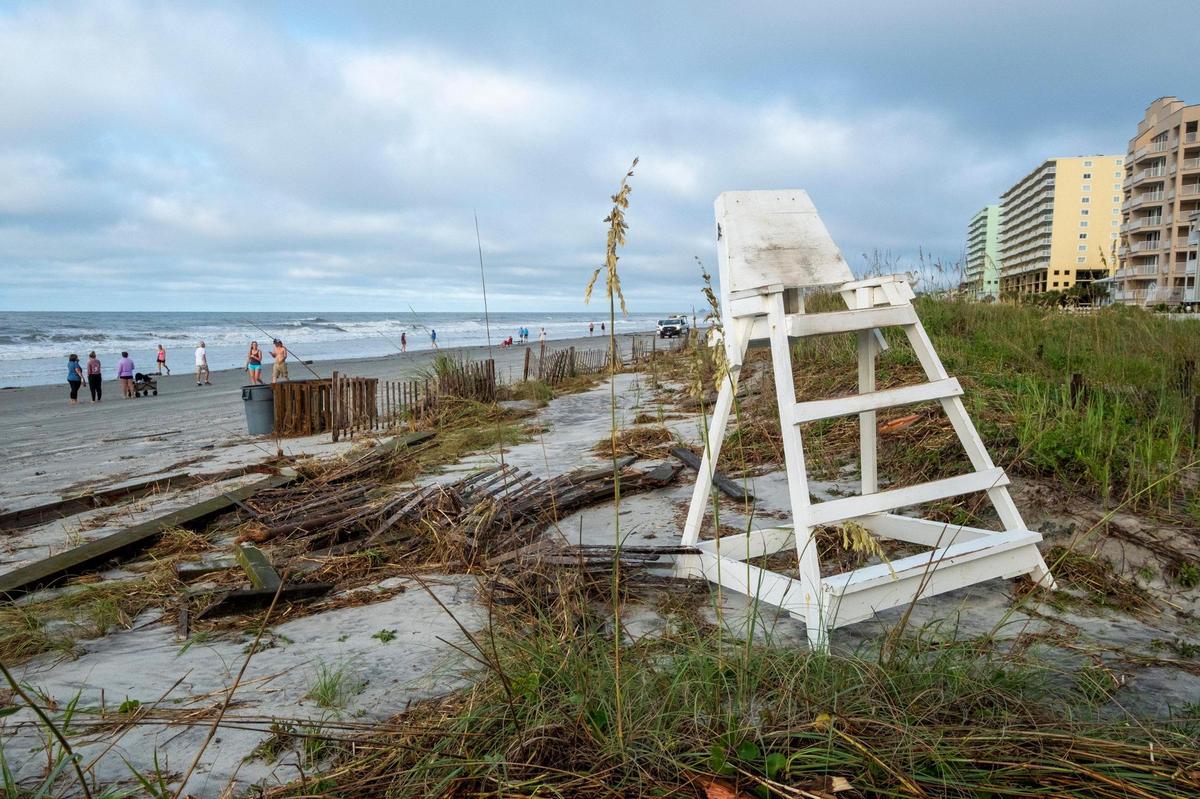 A storm surge from Hurricane Isaias combined with king tides damaged caused damage to the dunes in North Myrtle Beach and collapsed a section of the Sea Cabins Pier on Tuesday. August 4, 2020.