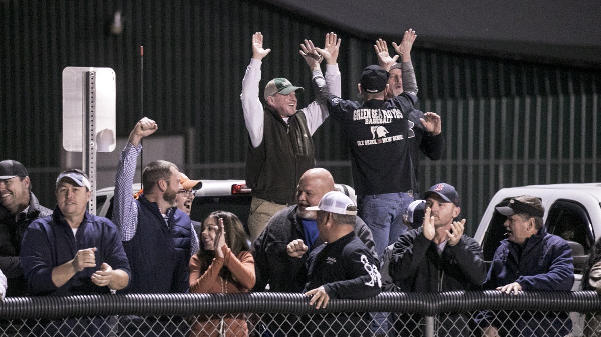 Fans cheer from the back of pick-up trucks in the Green Sea Floyds High School game against Hemingway. The Trojans won the Class A Lower State Championship against Hemingway Friday night with a score of 47-7 (final). Nov 30, 2018.