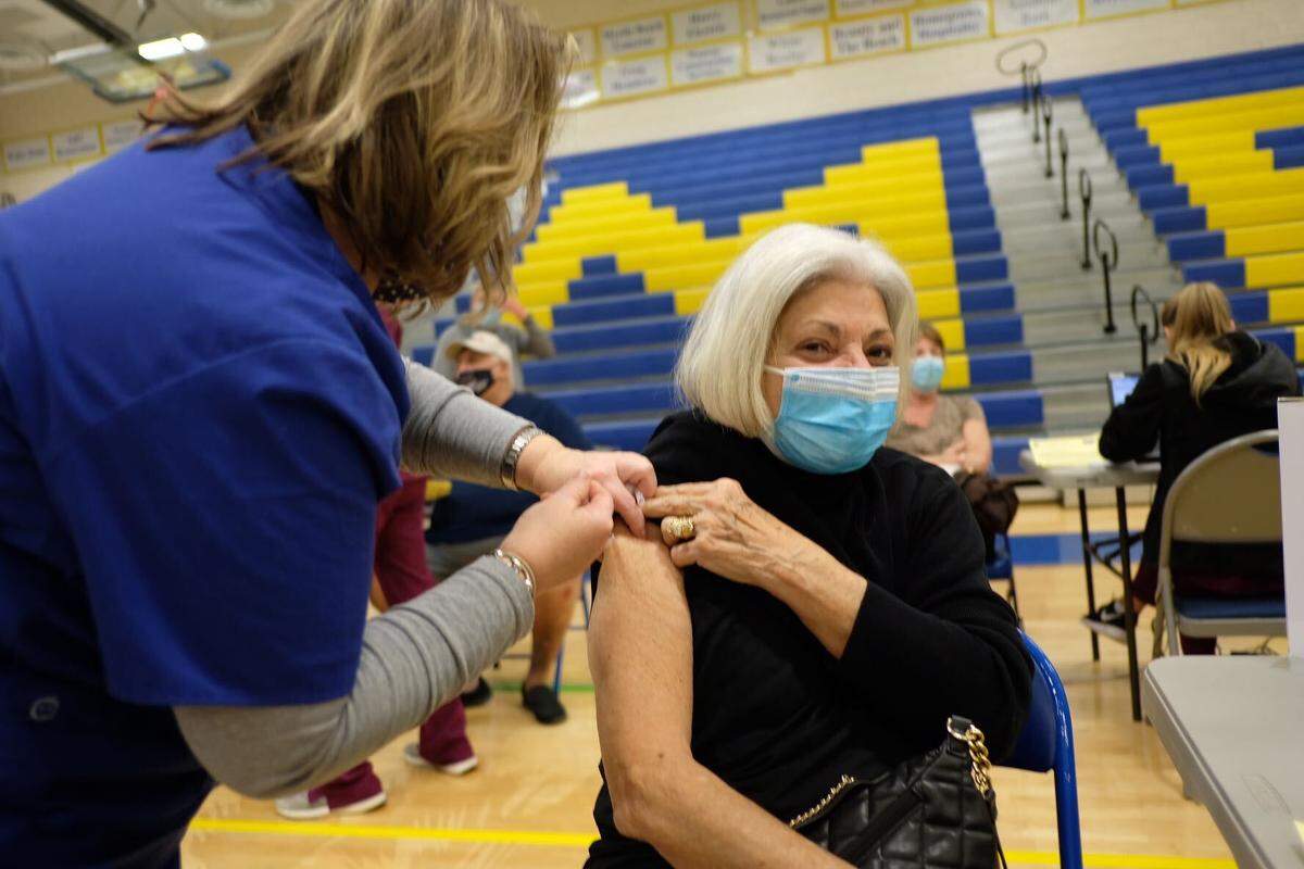 Vivian Gerfo gets her COVID-19 vaccine at North Myrtle Beach High School.