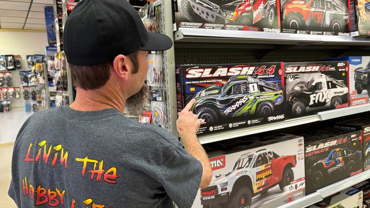 Ed’s Hobby Shop employee Will Endicott shows model cars at the store’s new Conway location. The longtime downtown Myrtle Beach business had to move because of construction on U.S. Highway 501. Dec. 5, 2023