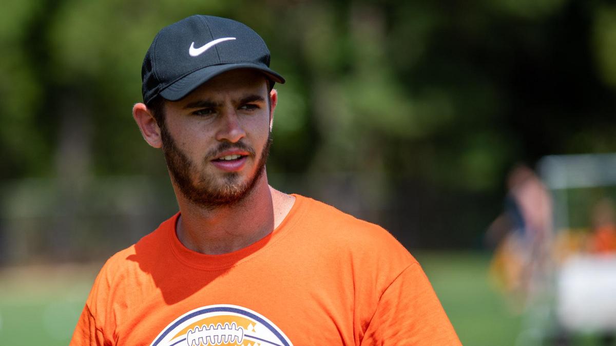 Oakland Raiders wide receiver Hunter Renfrow prepares to throw a pass during his first-ever football camp at Socastee High School in Socastee in July.