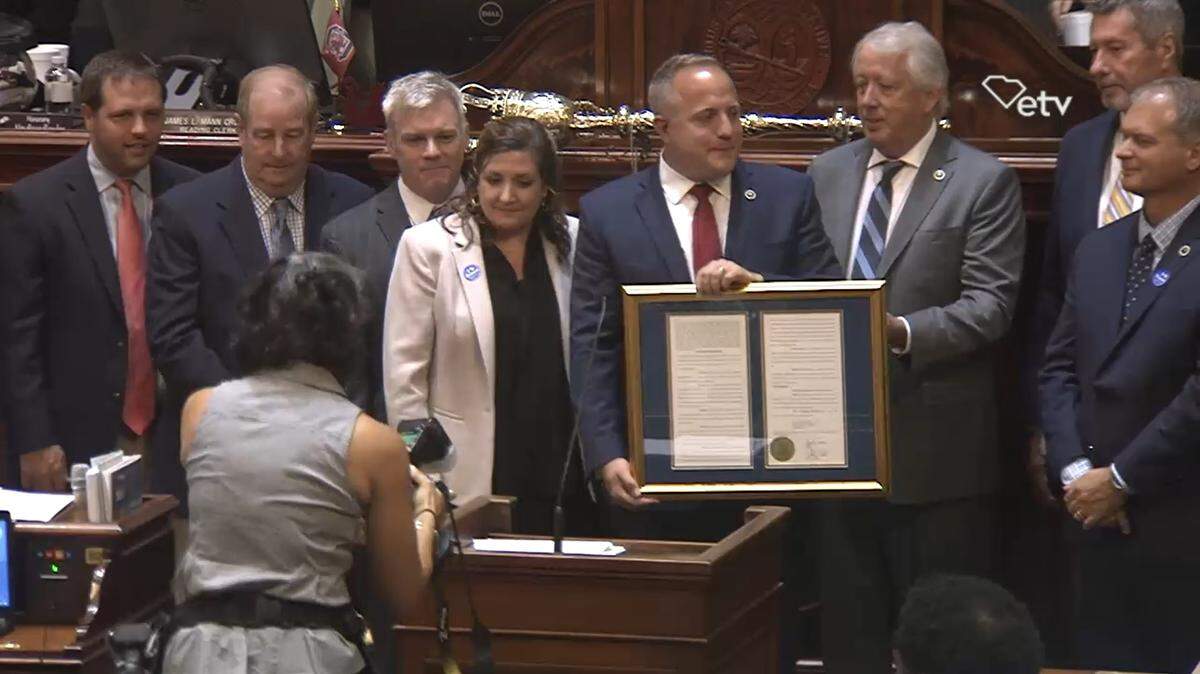 State Rep. Russell Fry, center, stands among the Horry County delegation at the S.C. Statehouse on June 28, 2022. Fry is departing the General Assembly as the presumptive nominee to the 7th Congressional District.