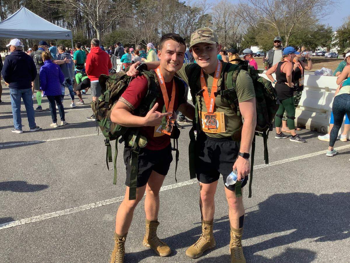 Jacob Guida (left) and Elliot Fish are members of the University of South Carolina Air Force ROTC and ran the half marathon Saturday with boots and 25-pound backpacks during the 25th Myrtle Beach Marathon.