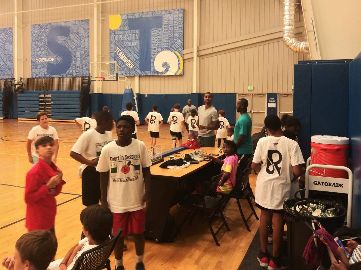 Myrtle Beach native and former NBA player Ramon Sessions helps keep the games running during his 12th annual youth basketball camp Tuesday.