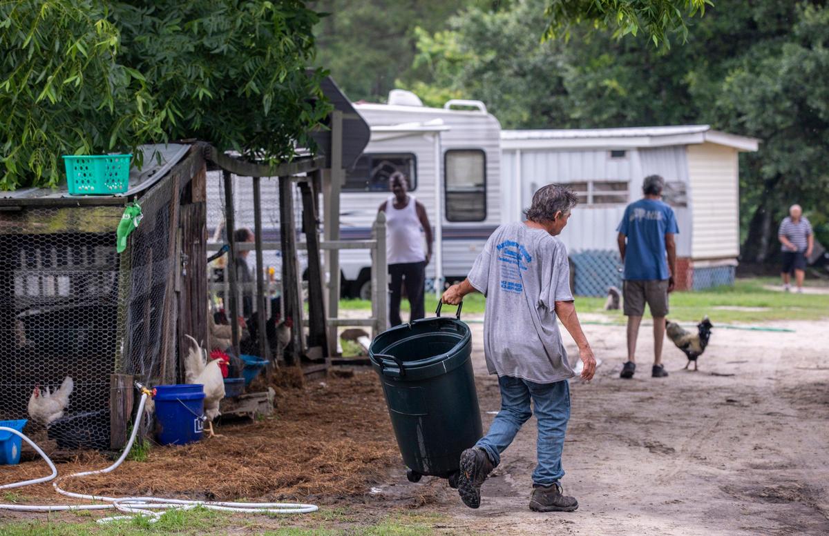 Residents of the Recovery Ranch in Loris perform morning chores around the farm. The Recovery Ranch, a Loris area refuge for those with drug addictions and mental health issues, has nearly doubled their number of residents since the beginning of the coronavirus pandemic. With some are recovery homes turning people away due to the virus, the farm has had as many as thirty new residents. May 27, 2020
